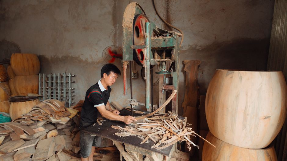 Carpenter crafting furniture in a workshop